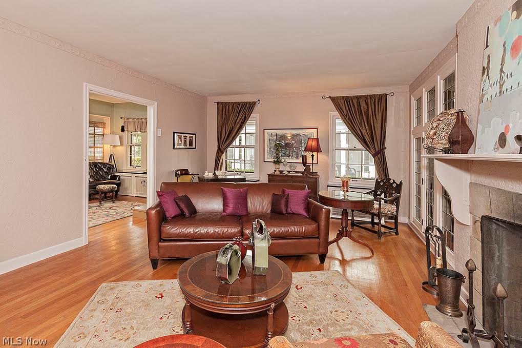 3010 Huntington Road Cleveland, OH 44120 - Photo 2 of 25 Inviting living room with floor to ceiling leaded windows and fireplace