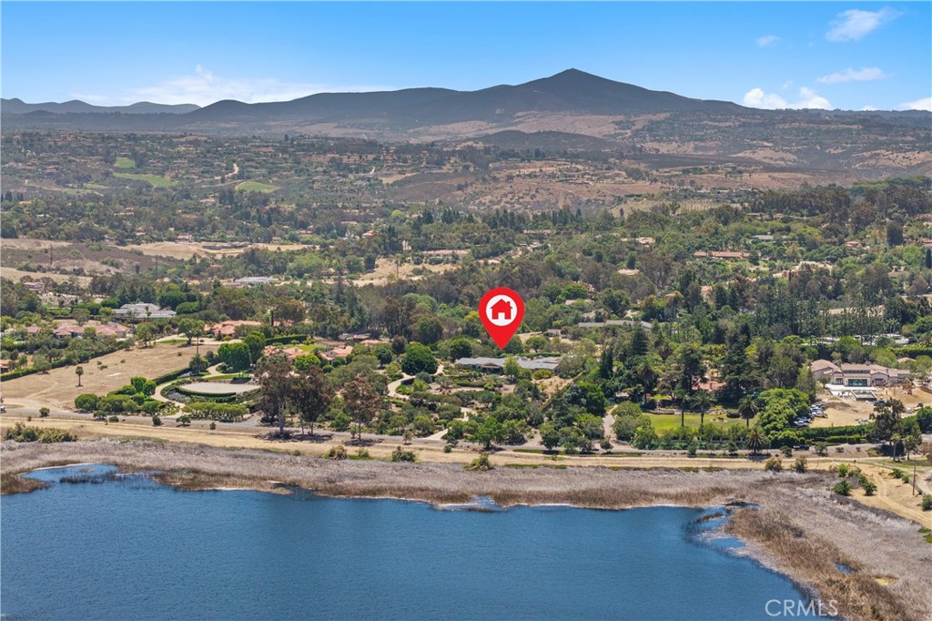 6533 Lago Lindo Rancho Santa Fe, CA 92067 - Photo 6 of 57 an aerial view of residential house and car parked