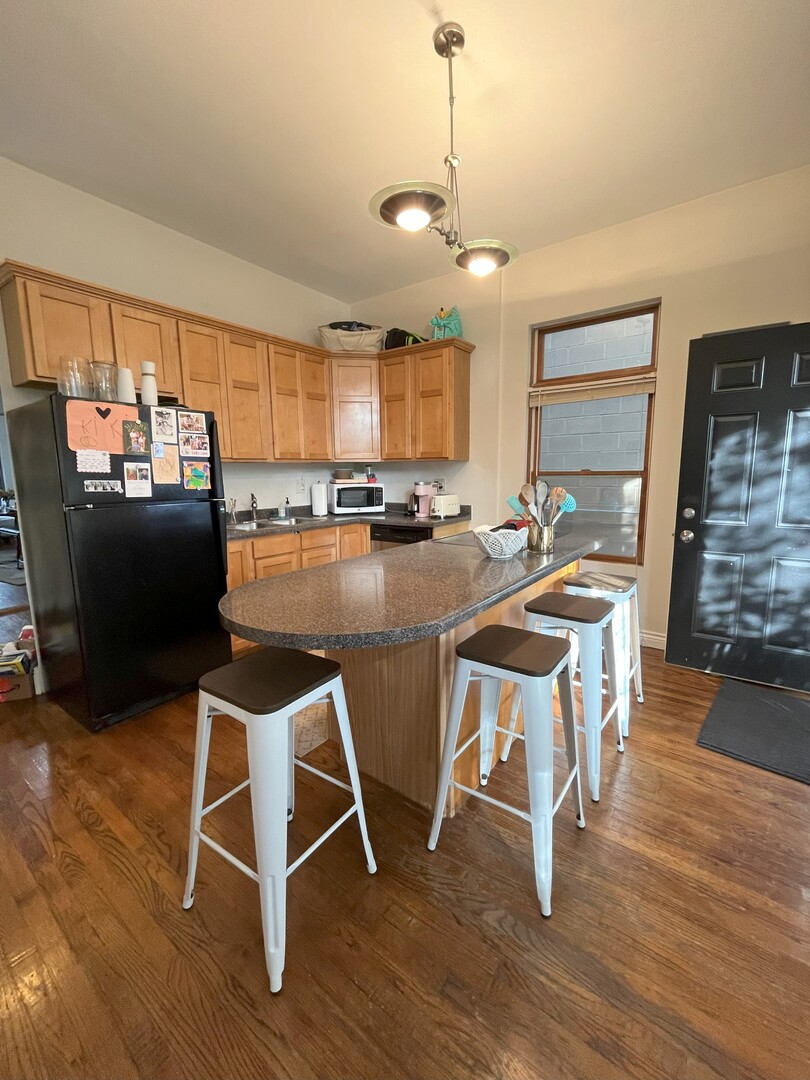 Undisclosed Address Chicago, IL 60622 - Photo 11 of 17 a view of a dining room with furniture and wooden floor