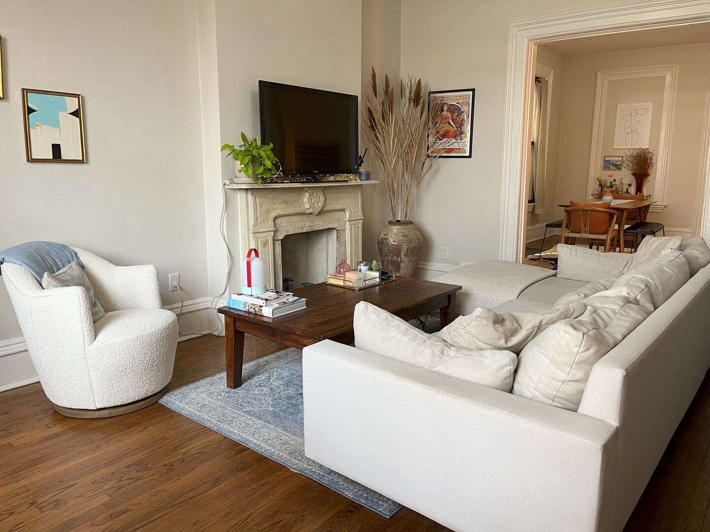 Undisclosed Address Chicago, IL 60622 - Photo 4 of 17 a living room with furniture a flat screen tv and a fireplace