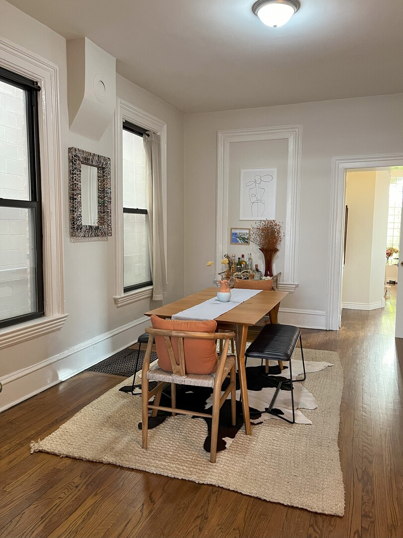 Undisclosed Address Chicago, IL 60622 - Photo 6 of 17 a dining room with wooden floor and a chandelier