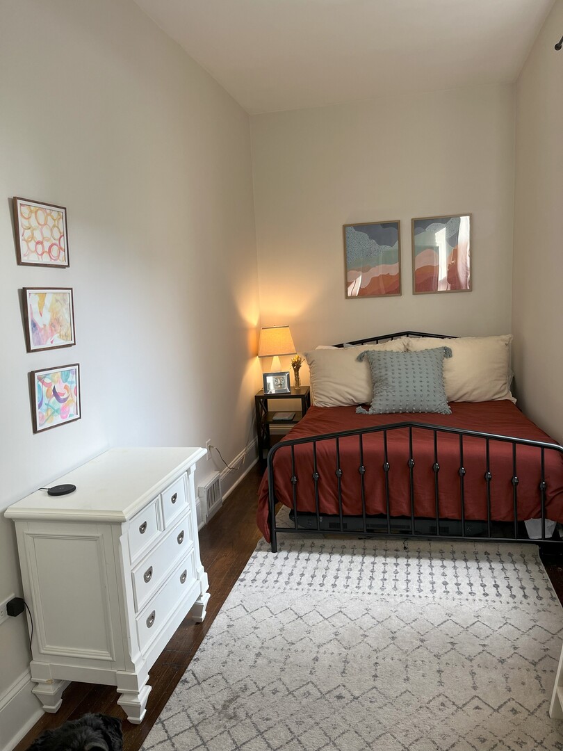 Undisclosed Address Chicago, IL 60622 - Photo 9 of 17 a bedroom with a bed and a dresser