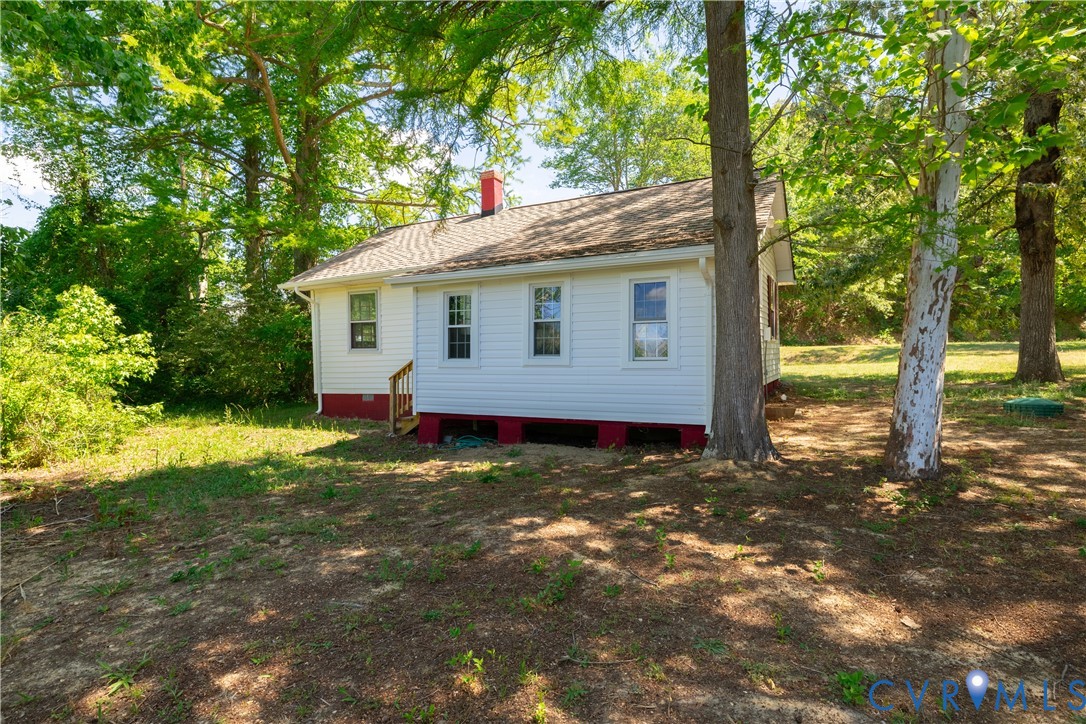 933 Pleasant Point Road Surry, VA 23883 - Photo 26 of 45 a view of a house with a yard