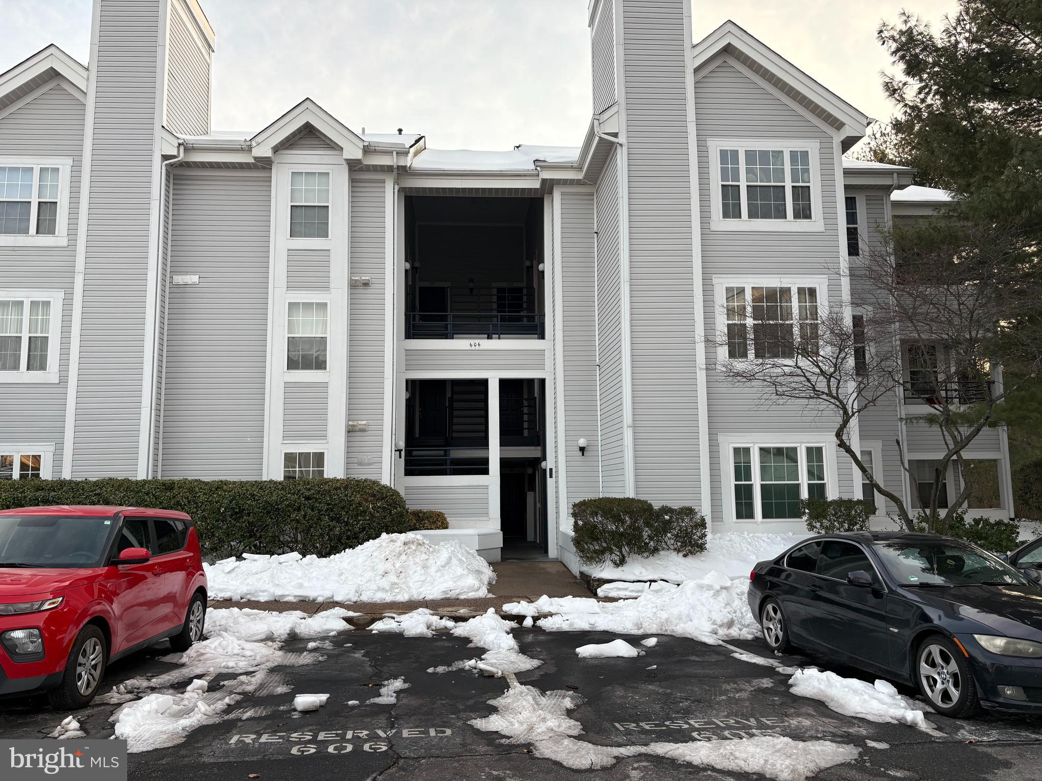 606 Moonglow Road, Unit 103 Odenton, MD 21113 - Photo 19 of 21 a front view of a house with a yard
