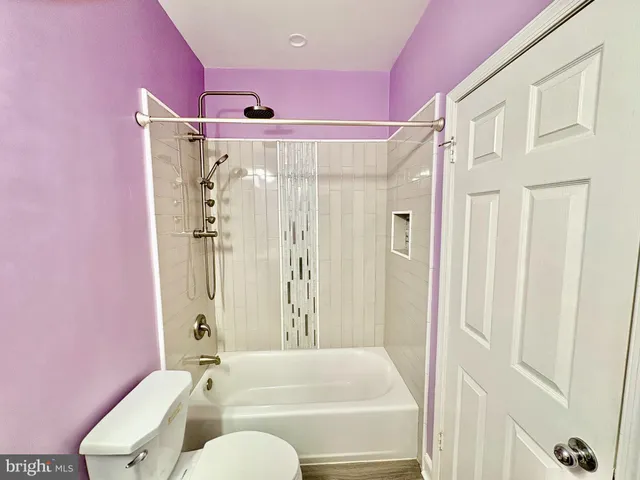 a bathroom with a shower curtain and a sink
