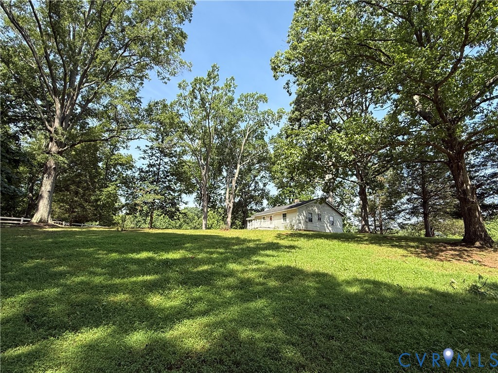 1600 Reams Road Powhatan, VA 23139 - Photo 4 of 10 Expansive grassy area with mature trees and a dist