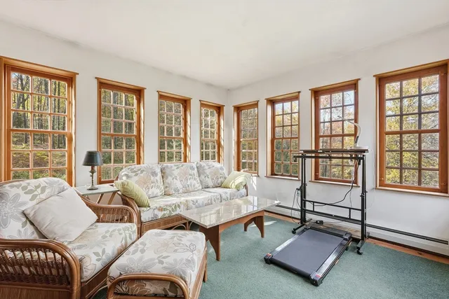 a bedroom with furniture and a window