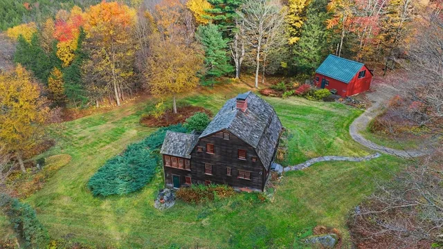 a backyard of a house with lots of green space