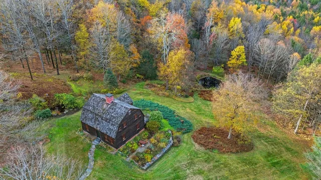 aerial view of a house with a yard