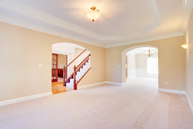 a view of an empty room with stairs
