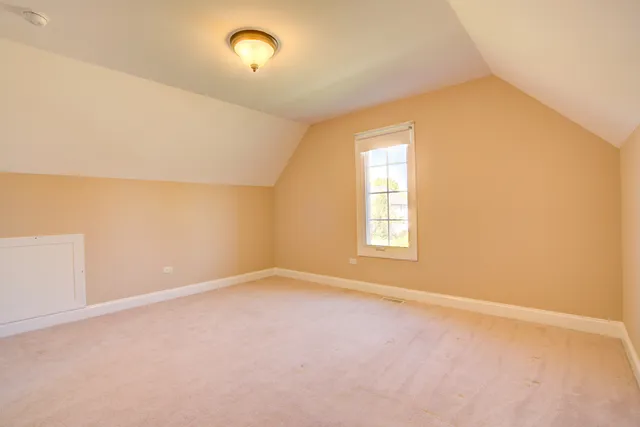 an empty room with a empty space and a window