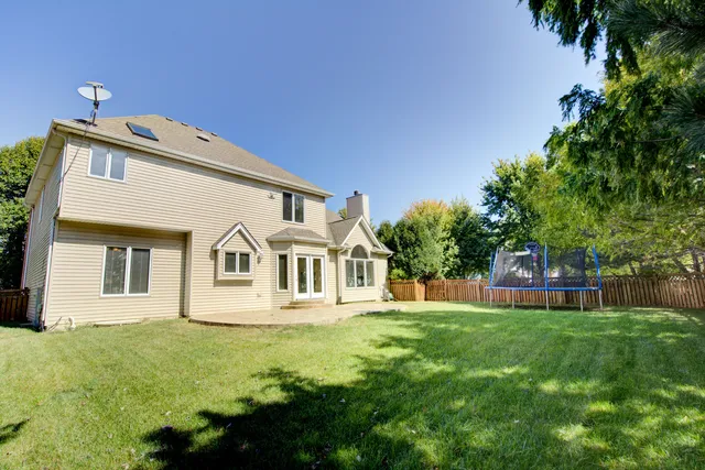 a view of a swimming pool with an outdoor space and seating area