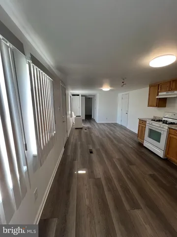 a view of a kitchen with a sink microwave and stove