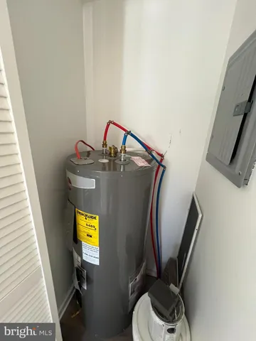 a bathroom with a toilet and a mirror