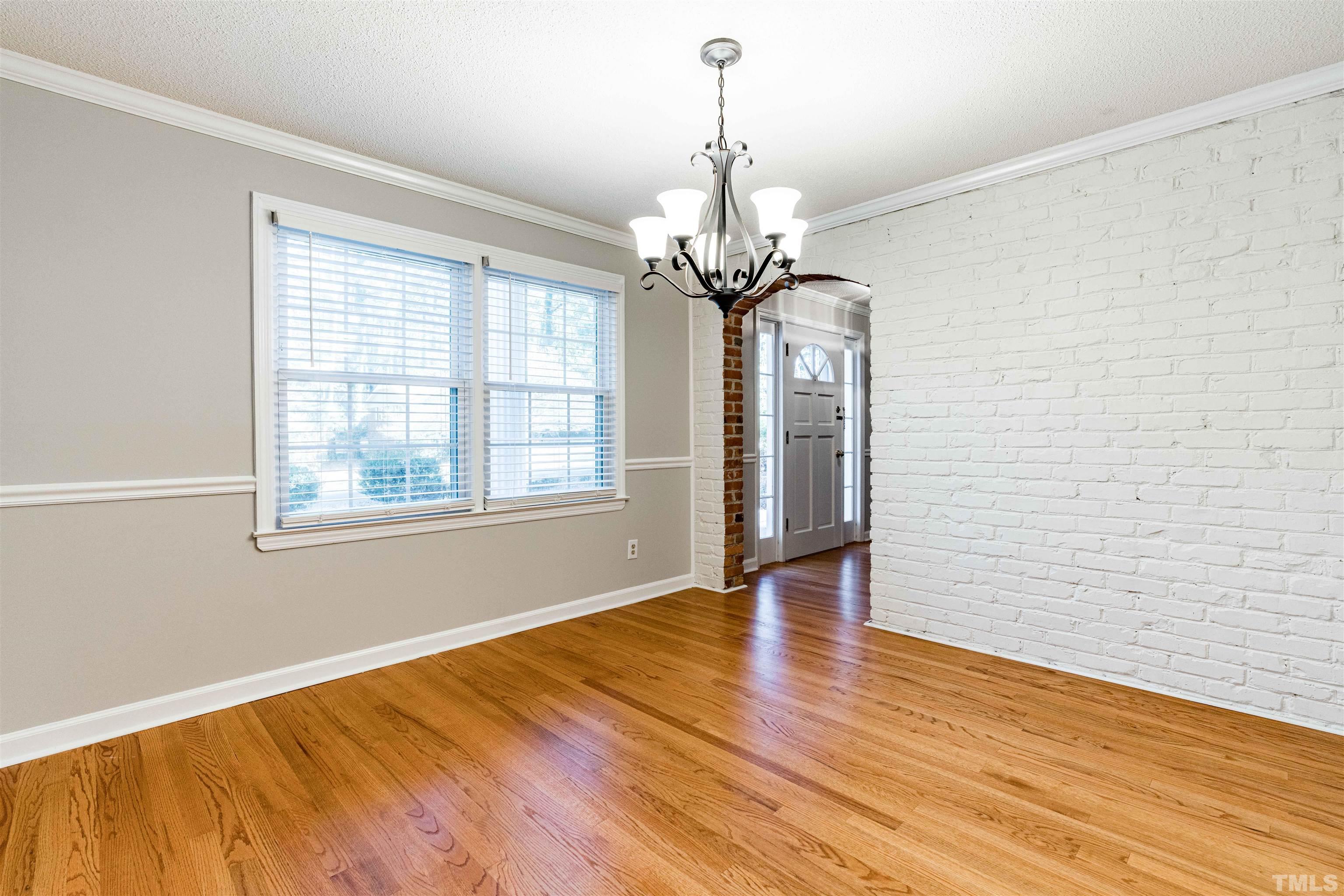 103 Marilyn Circle Cary, NC 27513 - Photo 16 of 64 a view of empty room with wooden floor and fan