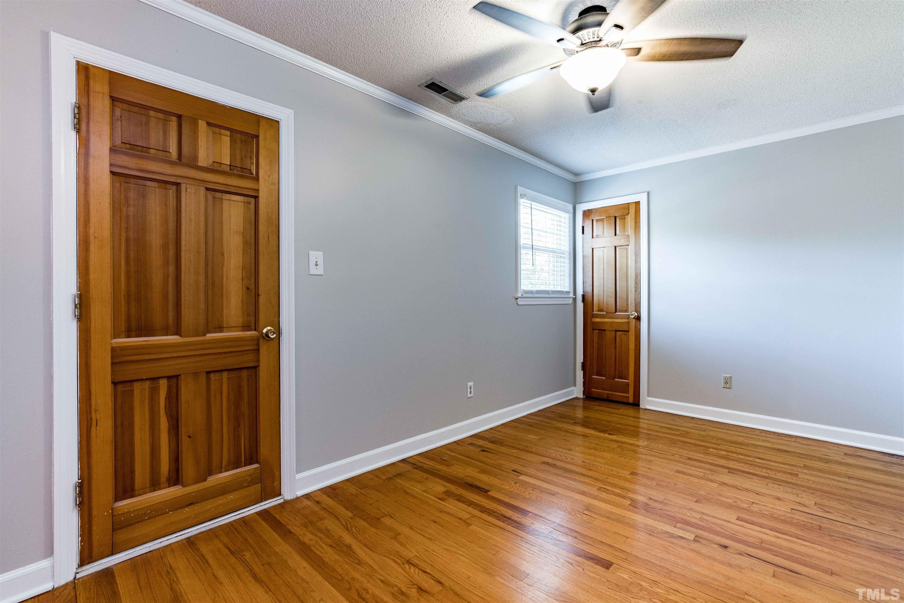 103 Marilyn Circle Cary, NC 27513 - Photo 27 of 64 wooden floor in an empty room with a window