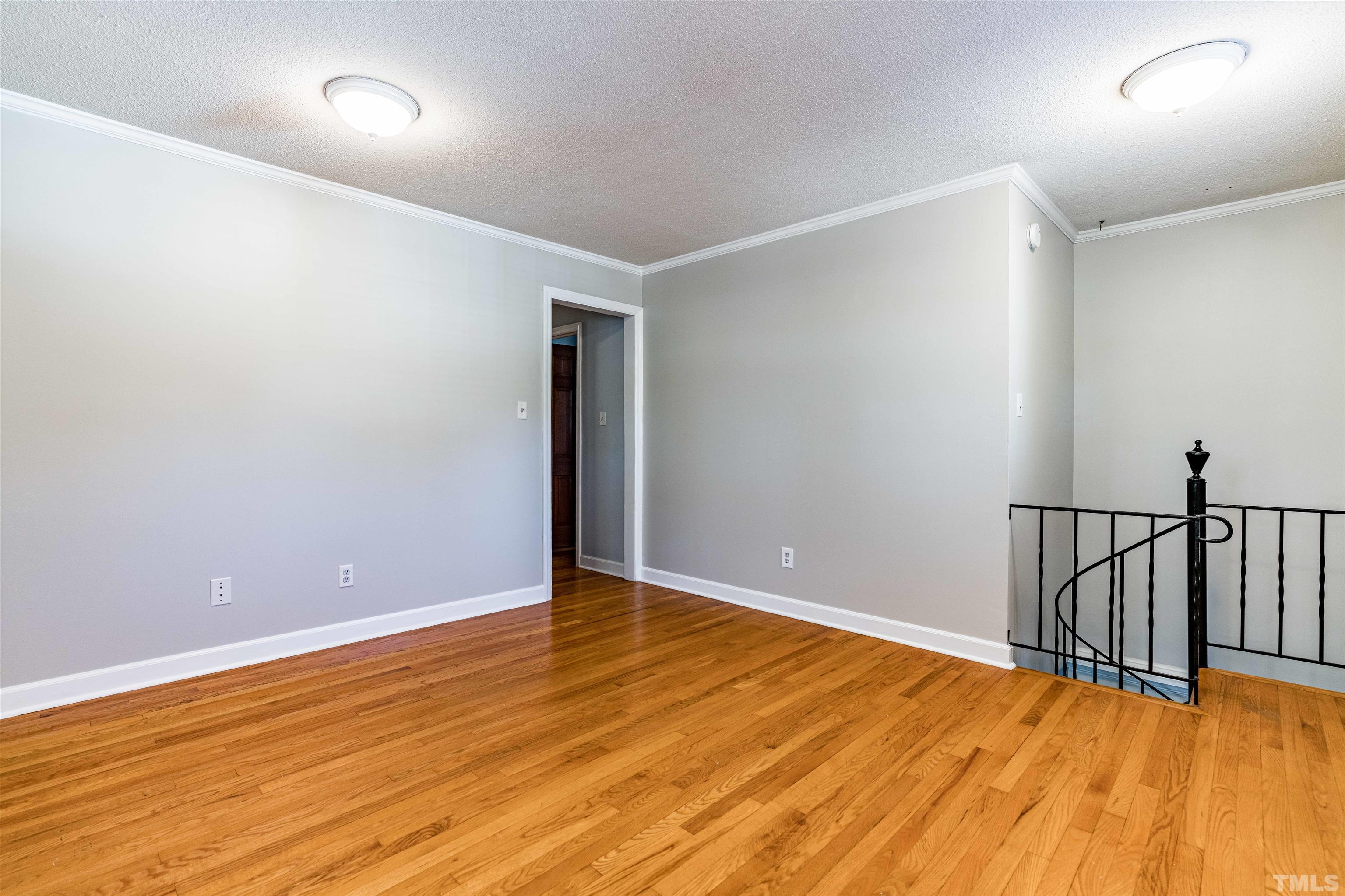 103 Marilyn Circle Cary, NC 27513 - Photo 31 of 64 a view of an empty room with wooden floor