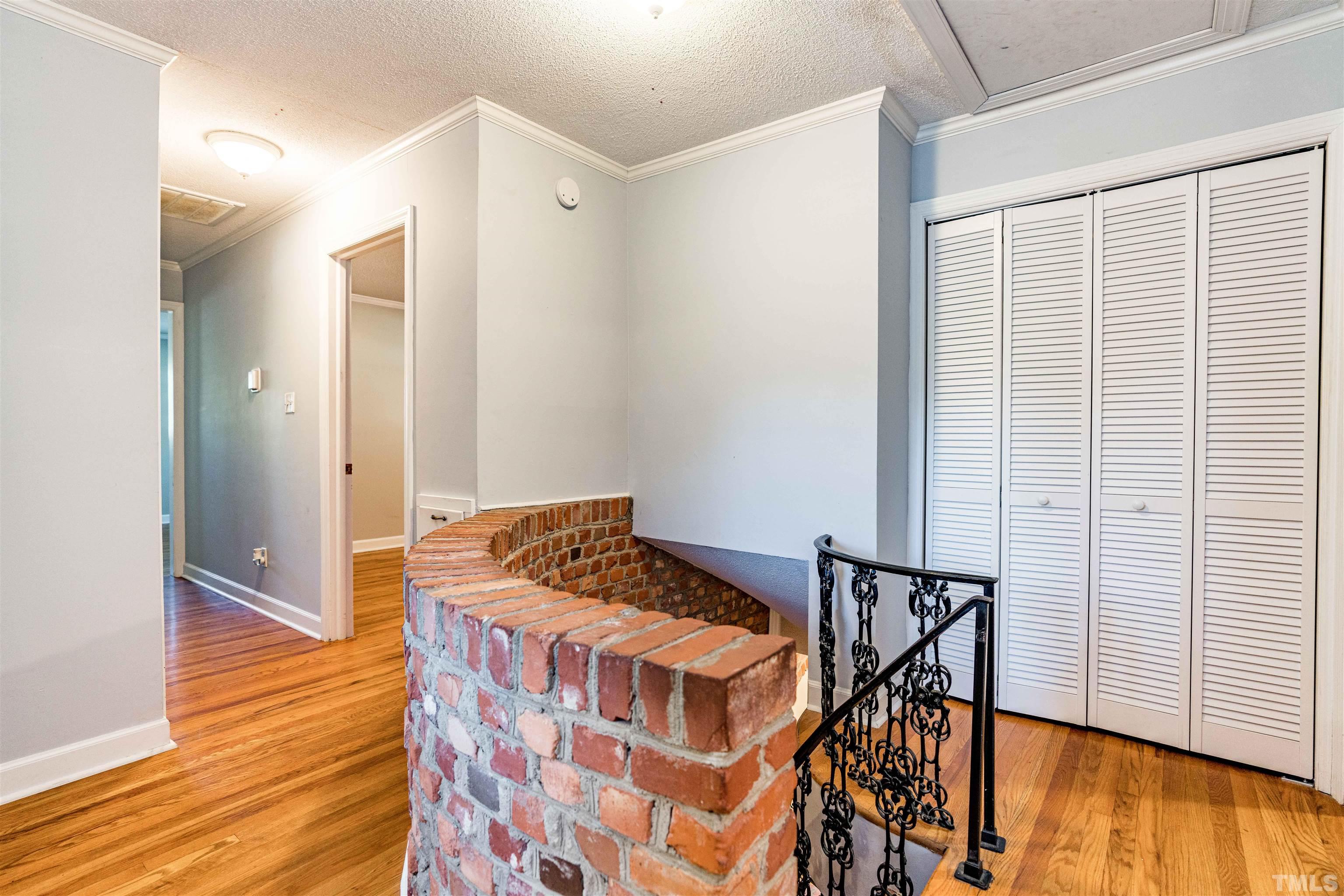 103 Marilyn Circle Cary, NC 27513 - Photo 33 of 64 a bedroom with a bed and wooden floor