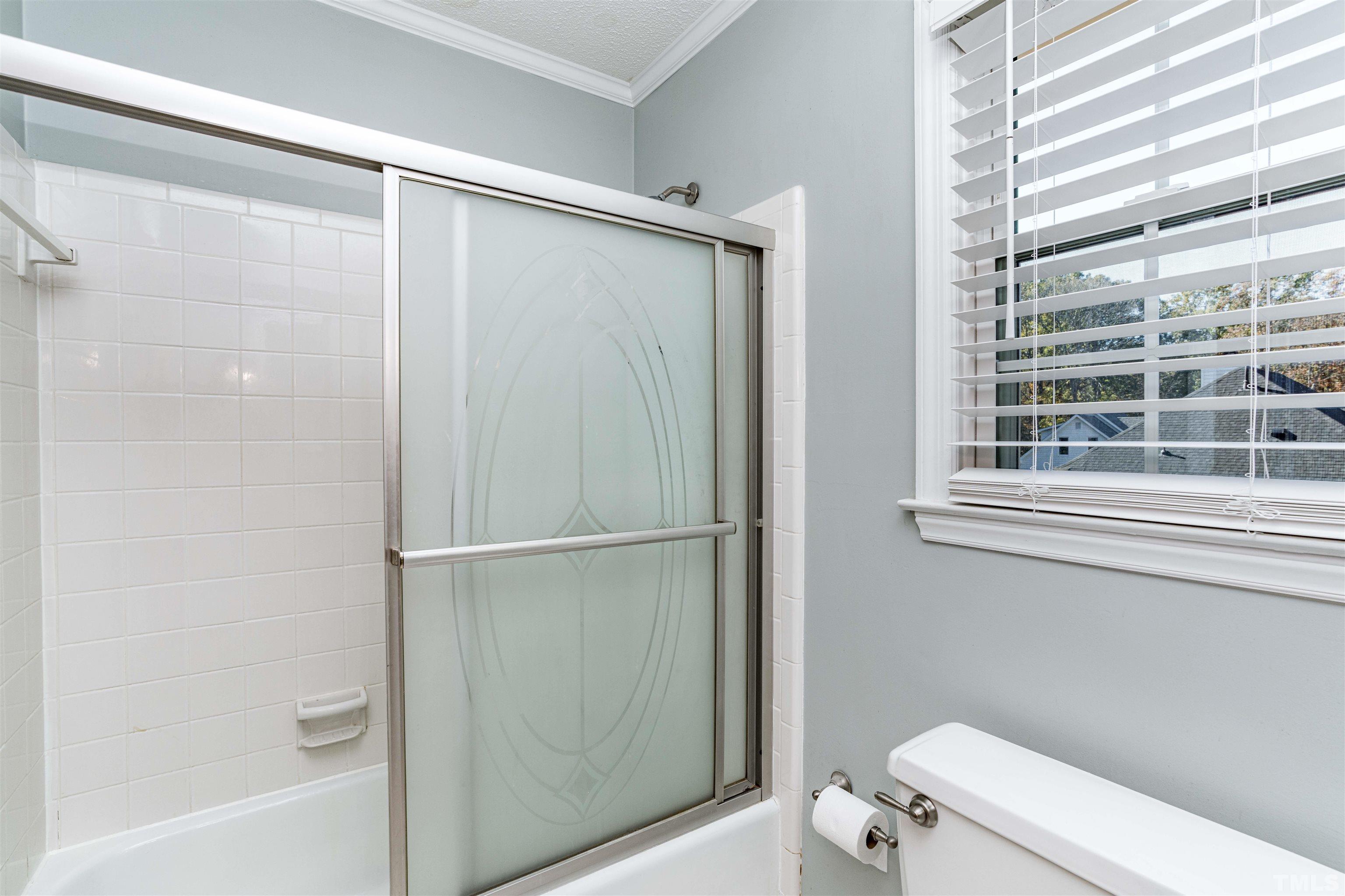 103 Marilyn Circle Cary, NC 27513 - Photo 41 of 64 a bathroom with a shower and a toilet