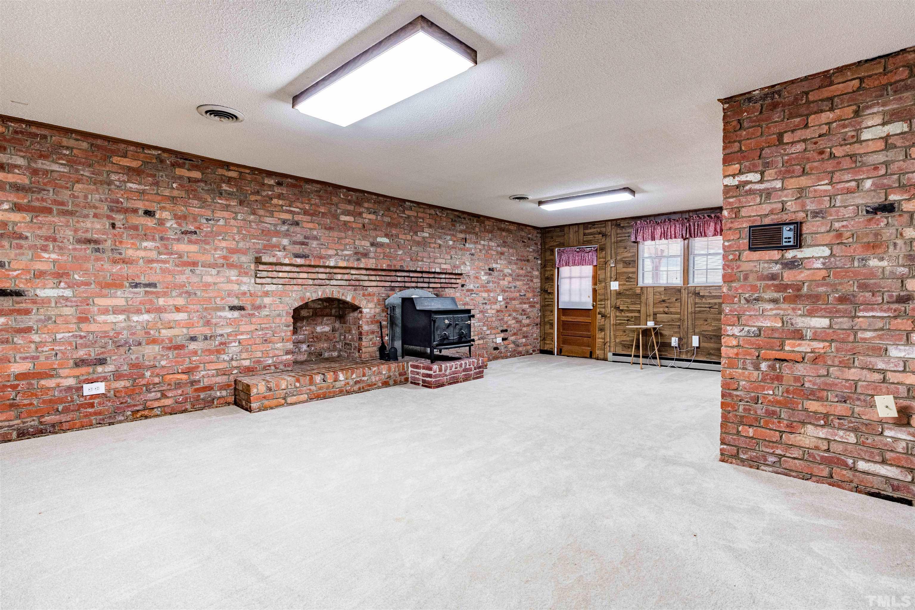 103 Marilyn Circle Cary, NC 27513 - Photo 44 of 64 a view of a livingroom with furniture and a fireplace