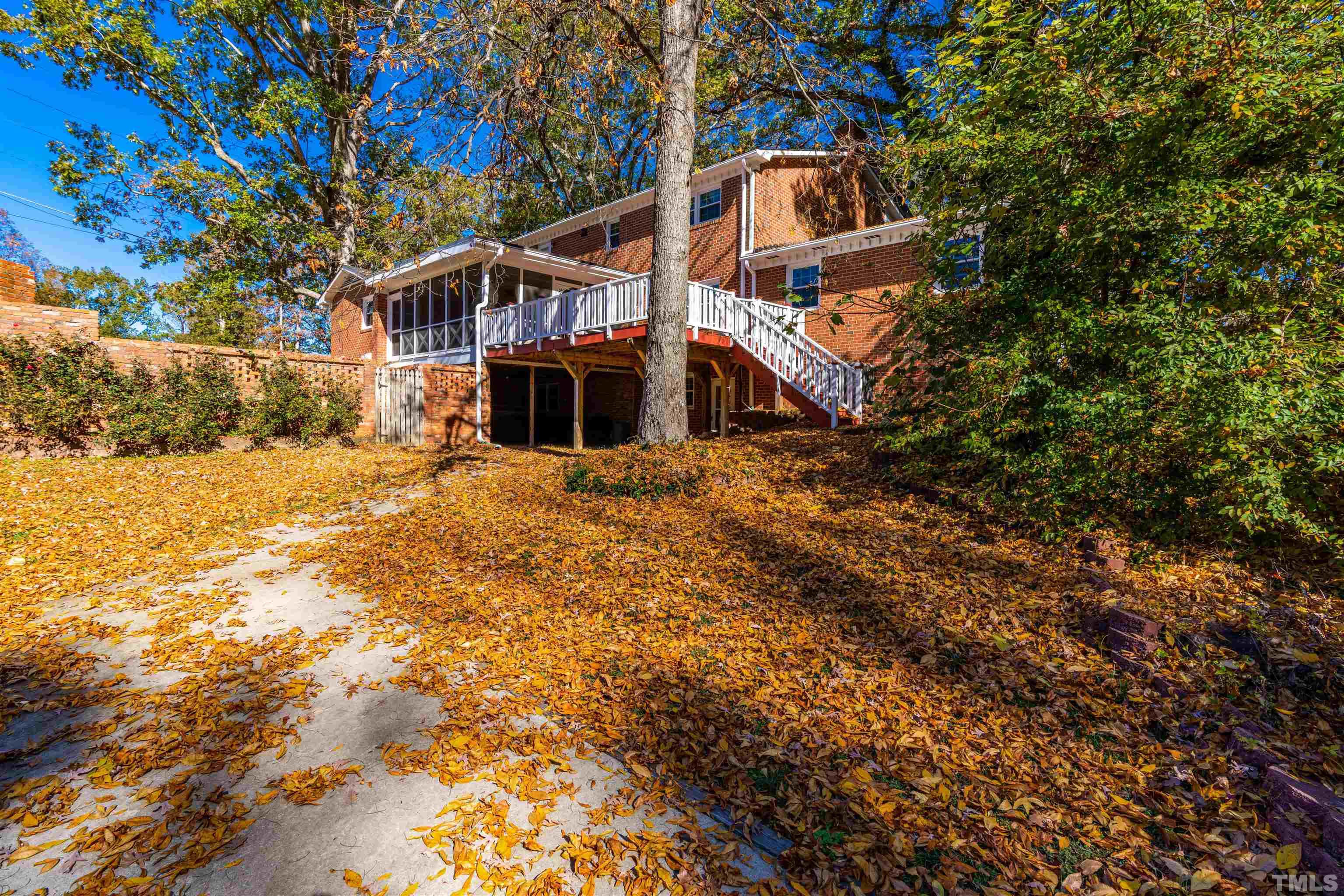 103 Marilyn Circle Cary, NC 27513 - Photo 57 of 64 a house that has a tree in front of it