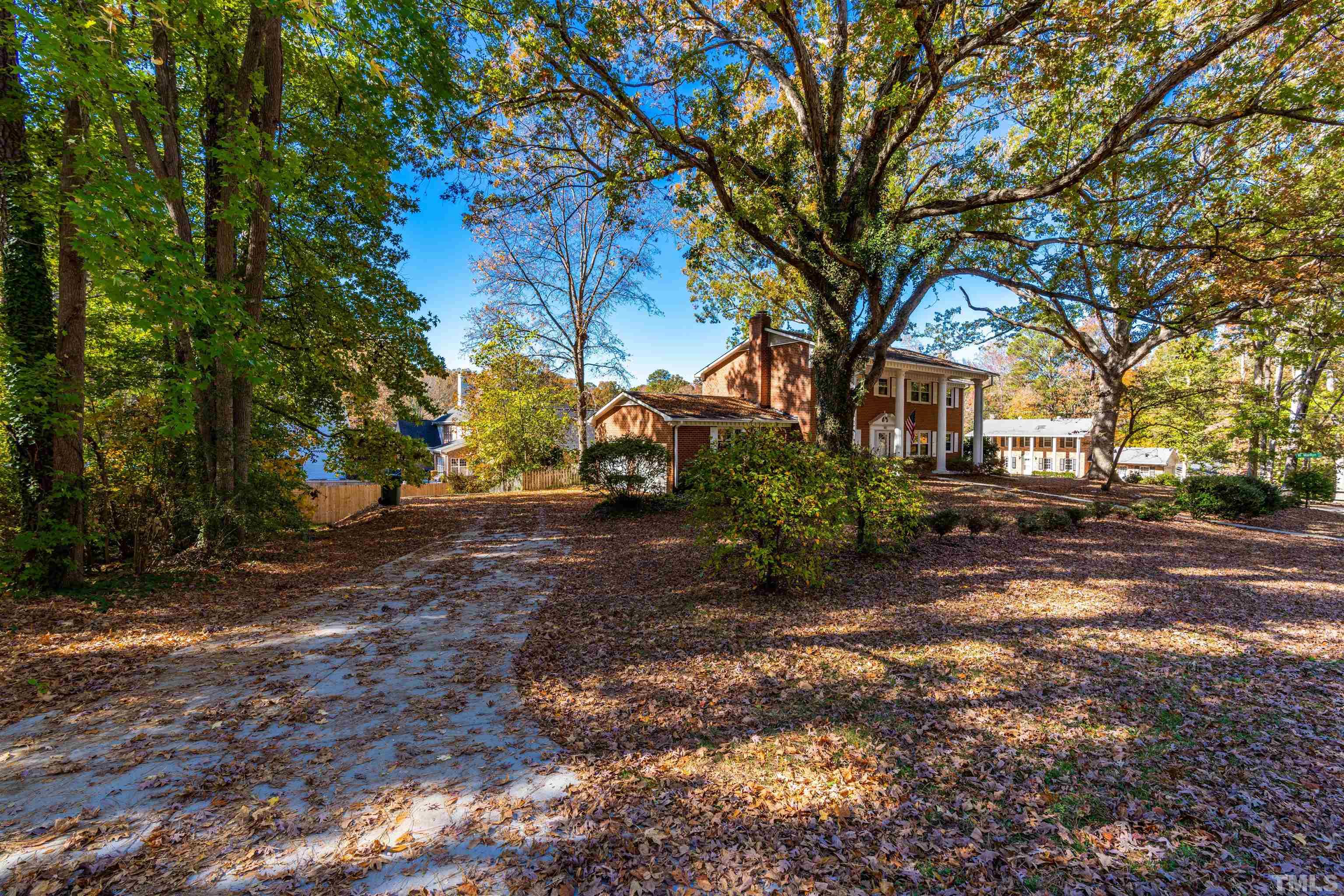 103 Marilyn Circle Cary, NC 27513 - Photo 63 of 64 a view of a tree in front of a house