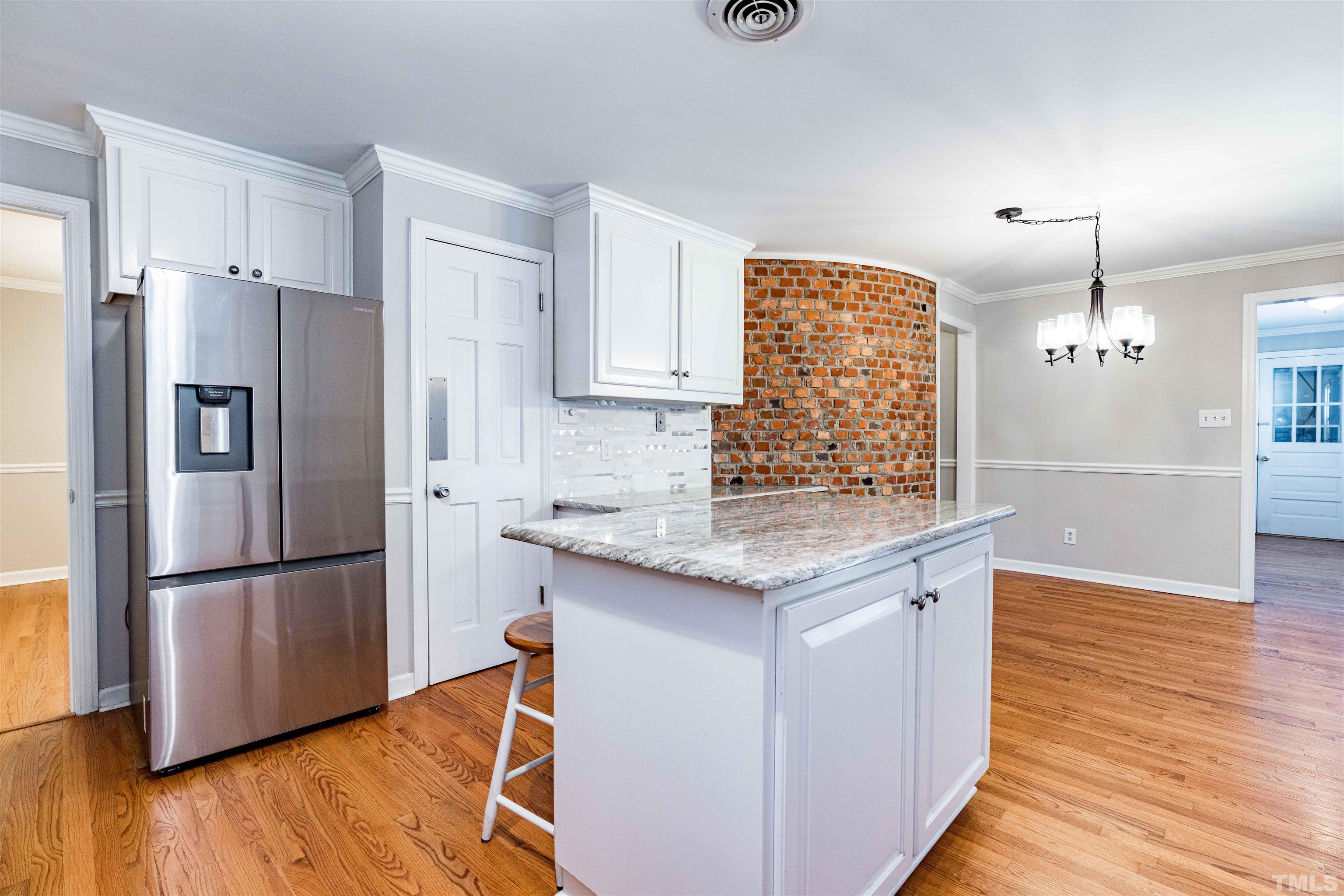 103 Marilyn Circle Cary, NC 27513 - Photo 9 of 64 a kitchen with stainless steel appliances granite countertop a refrigerator a sink and a stove