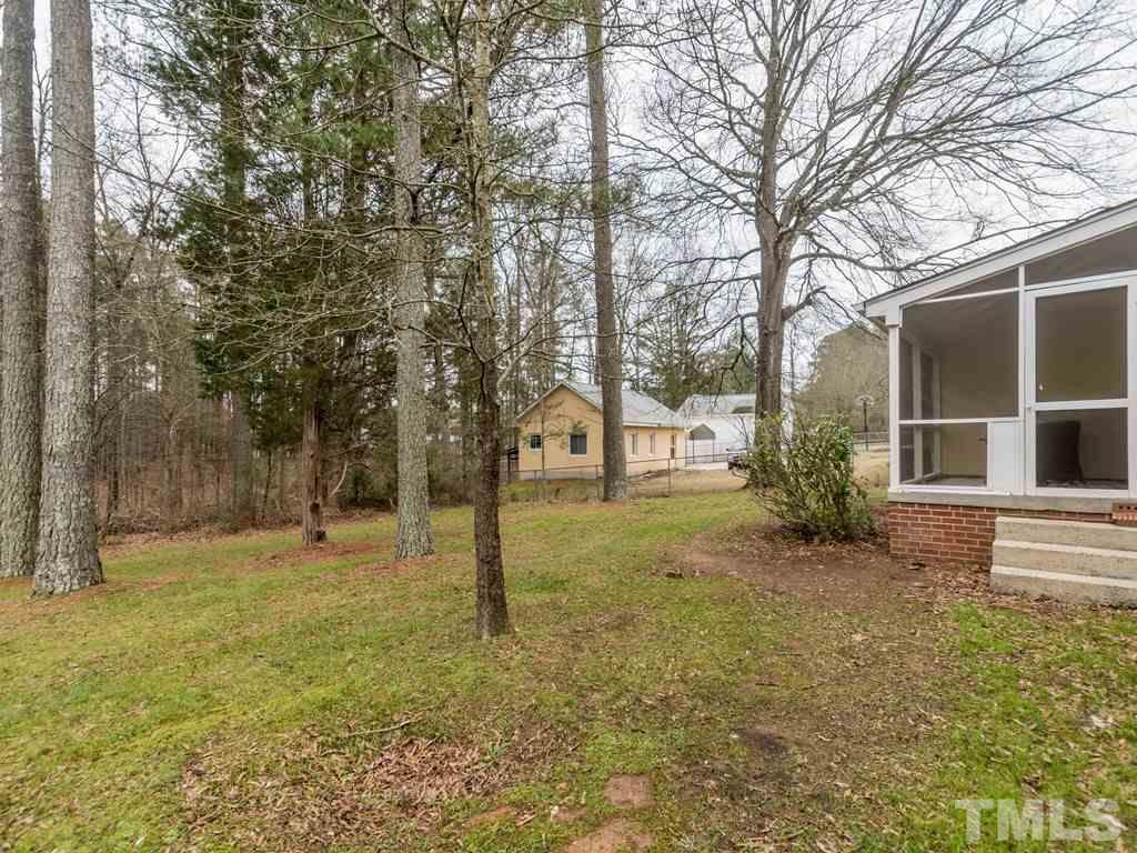 1524 Clermont Road Durham, NC 27713 - Photo 23 of 24 a view of a yard with a tree