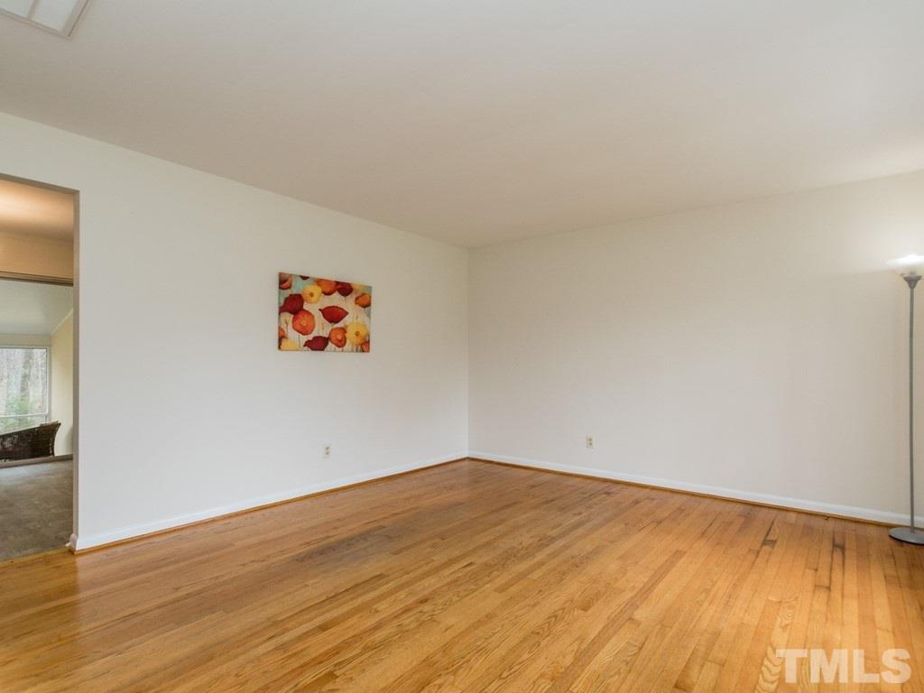 1524 Clermont Road Durham, NC 27713 - Photo 5 of 24 an empty room with wooden floor
