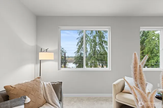 a view of a room that has a window and a view of it