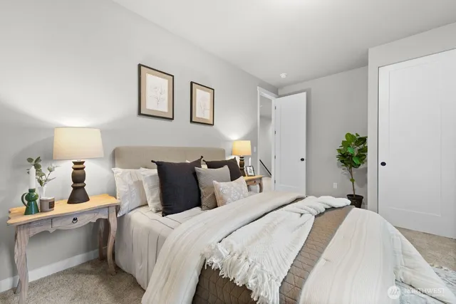 a bedroom with furniture and a window