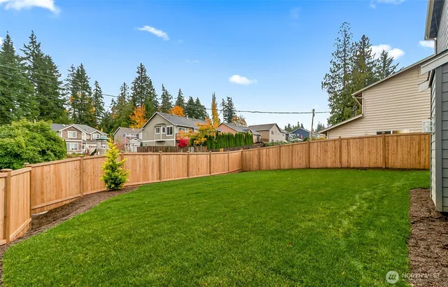 a view of a yard in front view of a building
