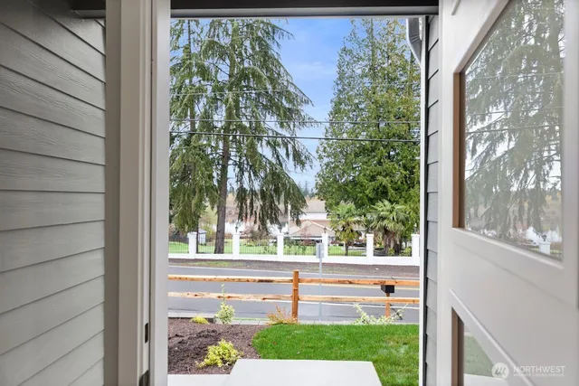 a backyard of a house with wooden floor yard and outdoor seating