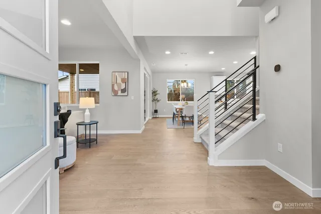 a view of entryway and hall with dining room