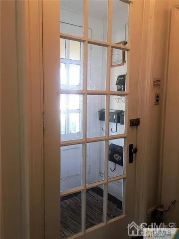 a bathroom with a glass shower door