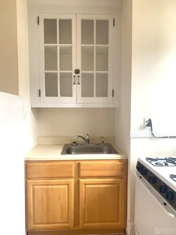 a bathroom with a toilet a sink and a window