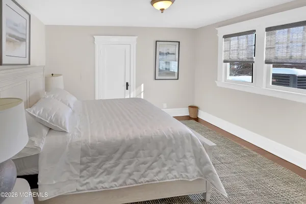 a large white bed in a white room