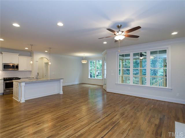2104 East Charlotte Court Raleigh, NC 27607 - Photo 4 of 23 The family room is completely open to the kitchen and nook areas for ideal entertaining. Hardwood floors throughout most of the downstairs.
