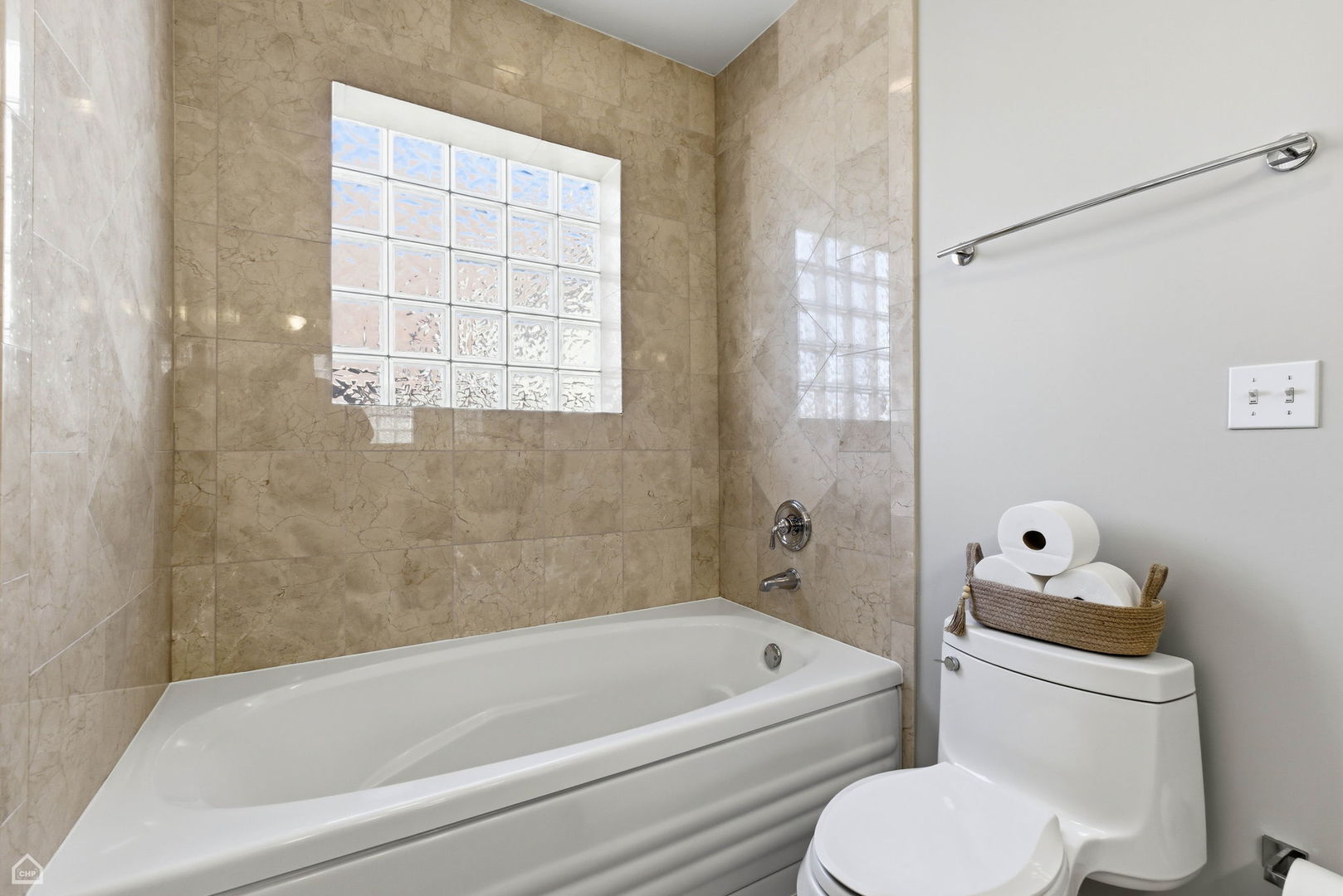 2249 West Foster Avenue, Unit 3 Chicago, IL 60625 - Photo 12 of 19 a bathroom with a toilet and a bathtub