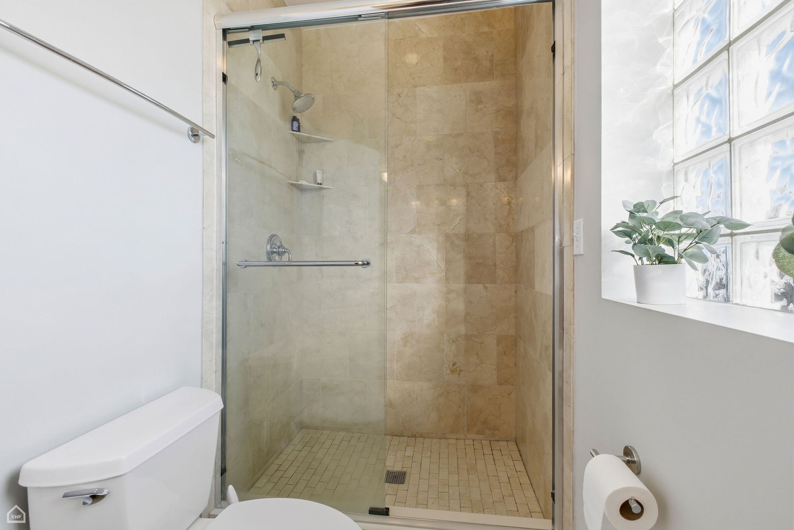 2249 West Foster Avenue, Unit 3 Chicago, IL 60625 - Photo 15 of 19 a bathroom with a shower and a toilet