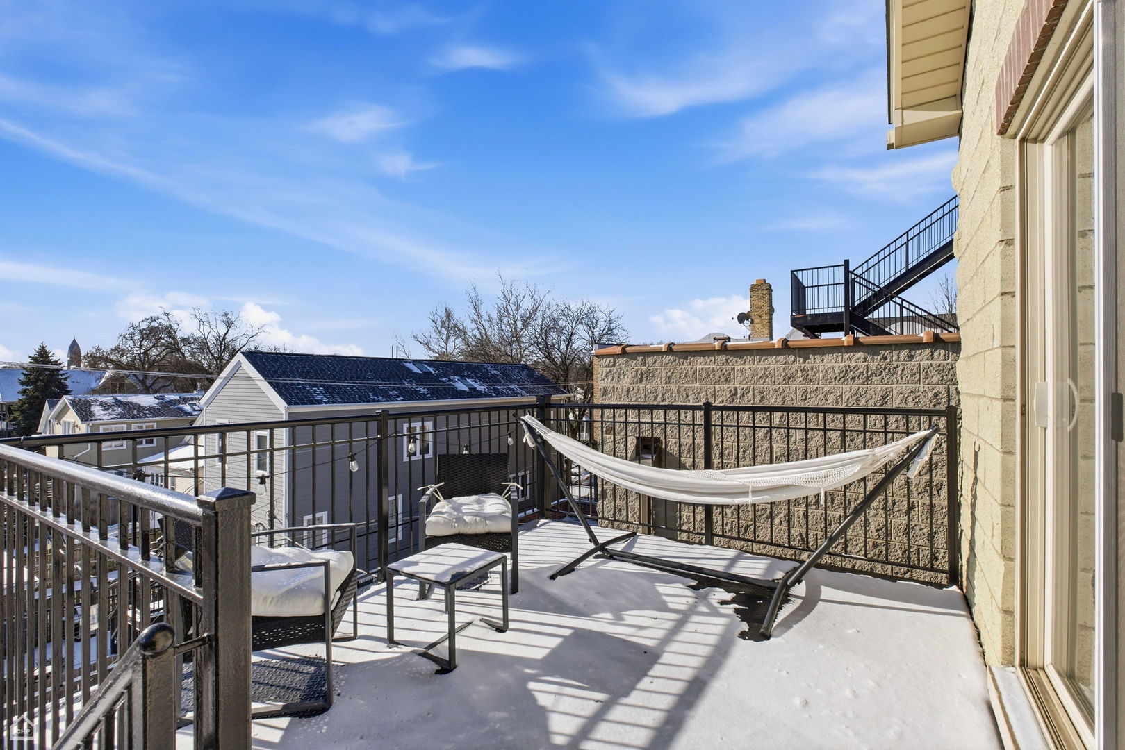 2249 West Foster Avenue, Unit 3 Chicago, IL 60625 - Photo 16 of 19 a view of balcony with wooden floor and outdoor seating