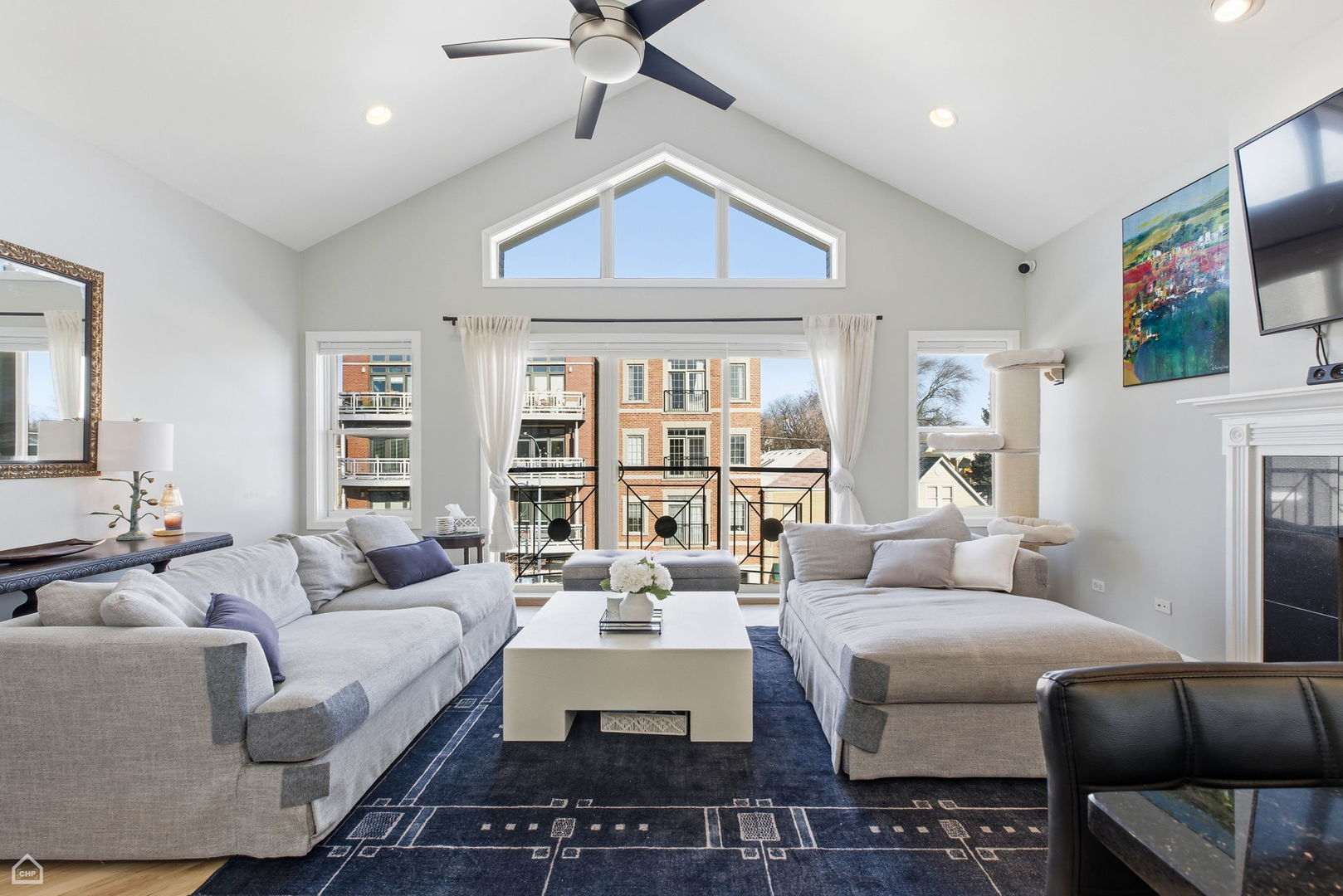2249 West Foster Avenue, Unit 3 Chicago, IL 60625 - Photo 2 of 19 a living room with furniture and a floor to ceiling window