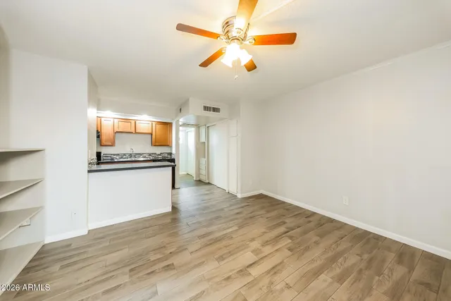 a view of kitchen with wooden floor and window
