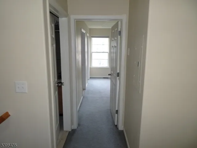 a view of a livingroom from a hallway