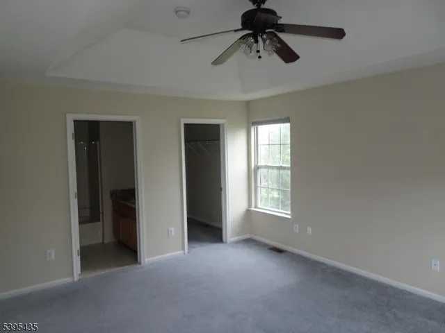 a view of empty room with windows