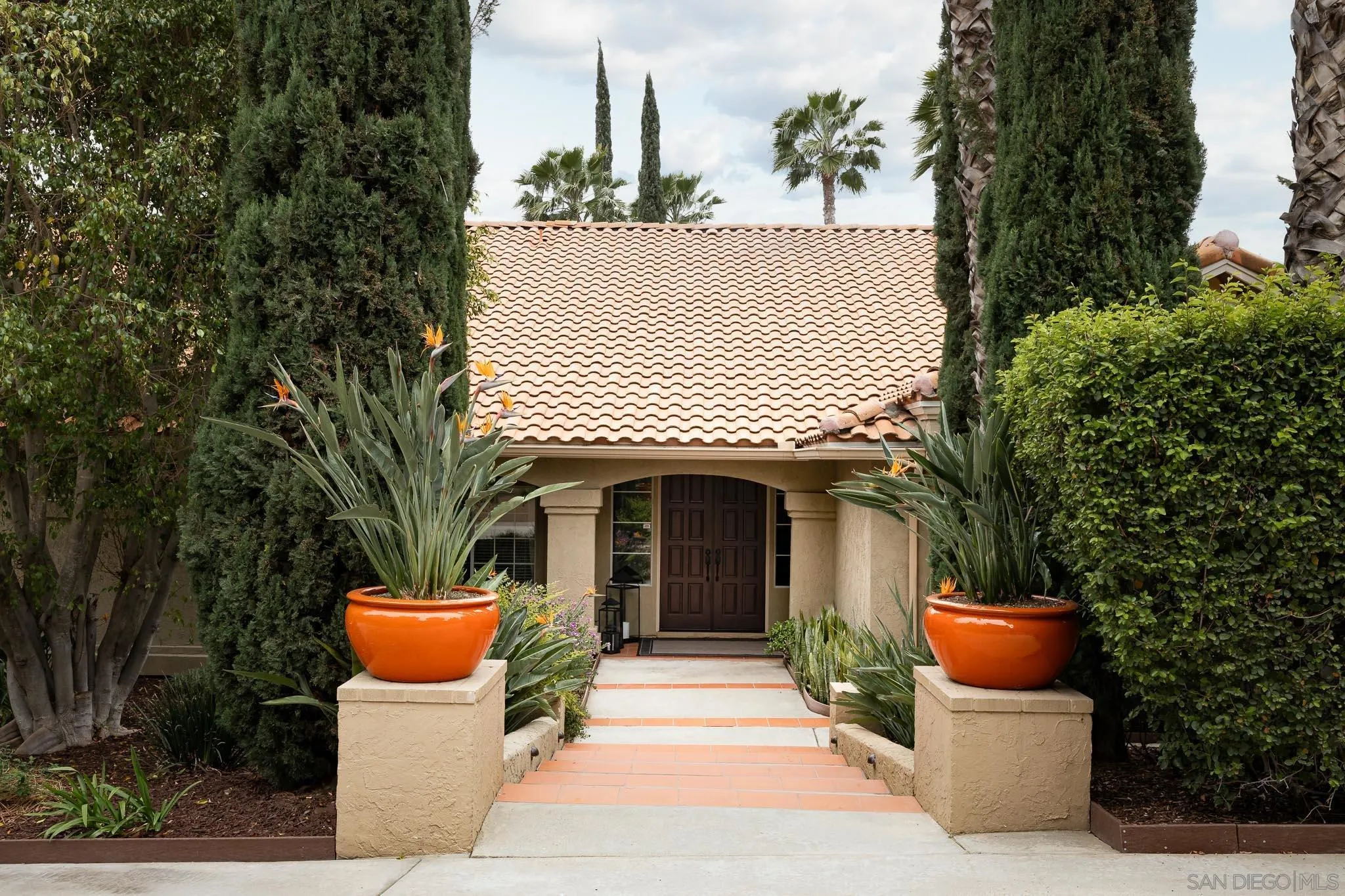 14135 Willow Ranch Road Poway, CA 92064 - Photo 46 of 47 a front view of a house with a garden and plants