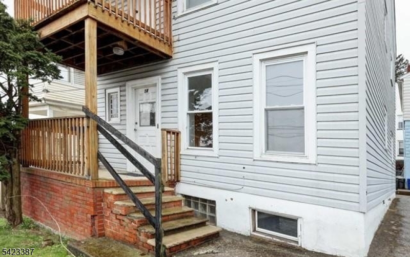 58 Westervelt Avenue Hawthorne, NJ 07506 - Photo 11 of 14 a view of a house with stairs and wooden floor
