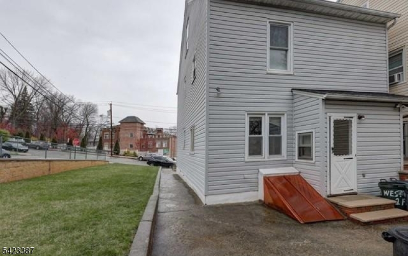 58 Westervelt Avenue Hawthorne, NJ 07506 - Photo 14 of 14 a front view of a house with a yard