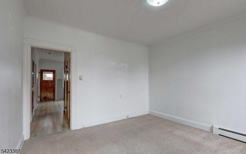 58 Westervelt Avenue Hawthorne, NJ 07506 - Photo 5 of 14 an empty room and a gallery