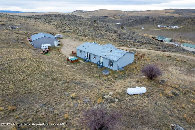an aerial view of a house with a outdoor space